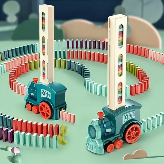 Toy train set with colorful dominoes on a green surface