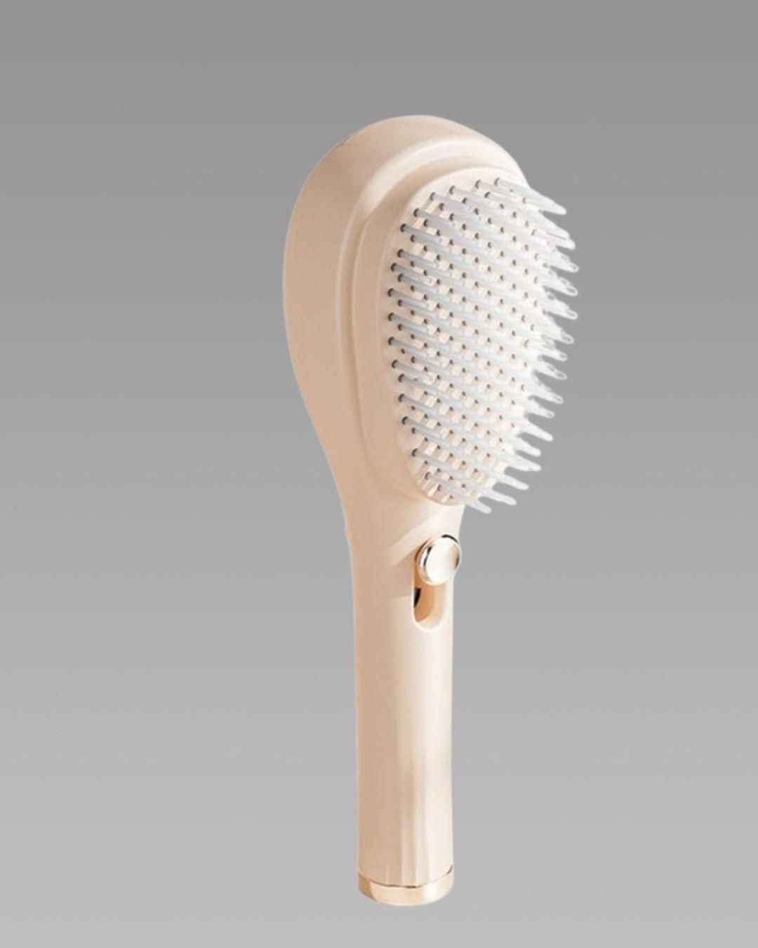Beige handheld shower brush with bristle head on a gray background