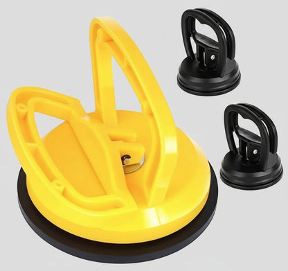 Yellow suction cup tool with two black suction cups on a white background